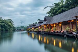 Wooden raft resort floating and mountain foggy in River Kwai on gloomy day at Kanchanaburi photo