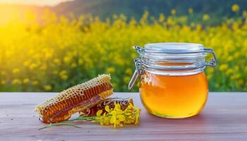 AI generated Sweet honeycomb and jar of honey with stick and mustard flowers Generated image photo