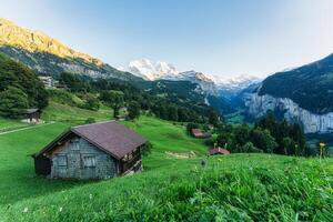 Wengen mountain village on bernese oberland and Lauterbrunnen valley with Jungfrau mountain in the evening at Switzerland photo