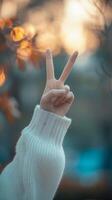 AI generated Close-up of female beautiful hand raising two fingers victory symbol, background image, generative AI photo