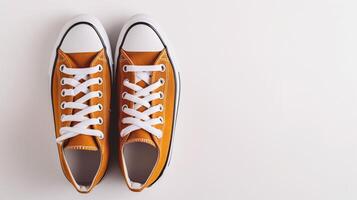 AI generated Amber canvas shoes isolated on flat white background with copy space for advertisement. Generative AI photo