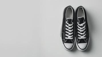 AI generated Black canvas shoes isolated on flat white background with copy space for advertisement. Generative AI photo