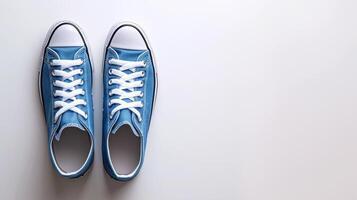 AI generated Blue canvas shoes isolated on flat white background with copy space for advertisement. Generative AI photo