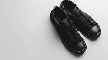 AI generated Black canvas shoes isolated on flat white background with copy space for advertisement. Generative AI photo