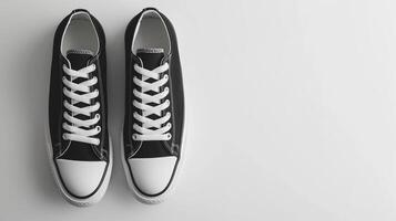 AI generated Charcoal canvas shoes isolated on flat white background with copy space for advertisement. Generative AI photo