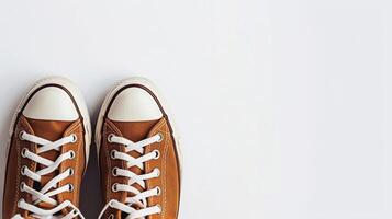 AI generated Brown canvas shoes isolated on flat white background with copy space for advertisement. Generative AI photo