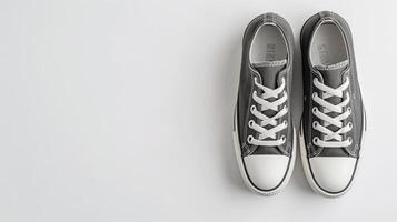 AI generated Charcoal canvas shoes isolated on flat white background with copy space for advertisement. Generative AI photo