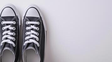 AI generated Charcoal canvas shoes isolated on flat white background with copy space for advertisement. Generative AI photo