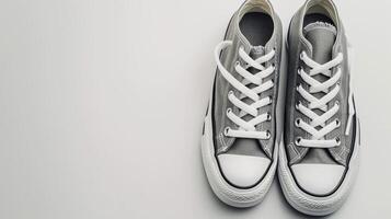 AI generated Grey canvas shoes isolated on flat white background with copy space for advertisement. Generative AI photo