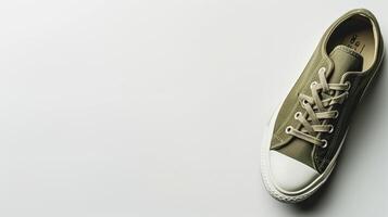 AI generated Olive canvas shoes isolated on flat white background with copy space for advertisement. Generative AI photo