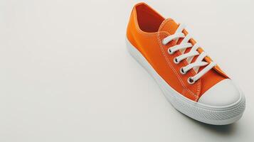 AI generated Orange canvas shoes isolated on flat white background with copy space for advertisement. Generative AI photo