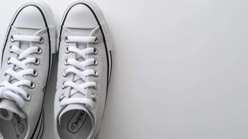 AI generated Silver canvas shoes isolated on flat white background with copy space for advertisement. Generative AI photo