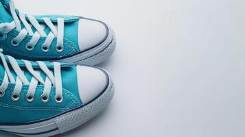 AI generated Teal canvas shoes isolated on flat white background with copy space for advertisement. Generative AI photo