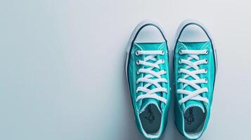 AI generated Teal canvas shoes isolated on flat white background with copy space for advertisement. Generative AI photo