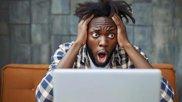 AI generated A black man with a shocked expression and holding his head while looking at the laptop in front of him, background image, generative AI photo