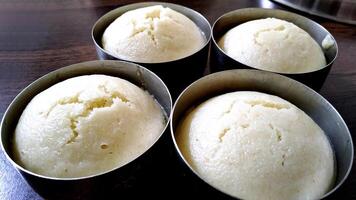 Indian vegetarian rice cakes breakfast, known as idli photo