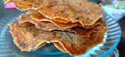 closup view of Indian Snack Papad, deep fried and roasted, made up of Urad, Moong dal or rice. Selective focus photo