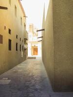 A walkway with beautiful contrasts of light and shadow creates a feeling of conflict and harmony at the same time. photo