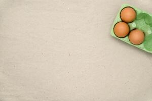 Green carton of different eggs. Easter background photo