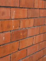 Red brick wall texture with grey grout texture photo