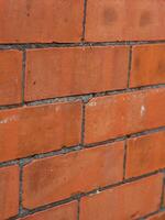 Red brick wall texture with grey grout texture photo