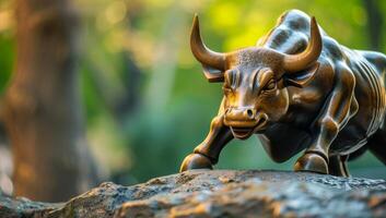 AI generated A majestic bronze bull statue stands amidst a natural green backdrop photo