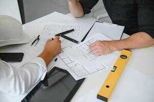 Engineers are helping to design work on blueprints and collaborate on structural analyzing of project types. photo