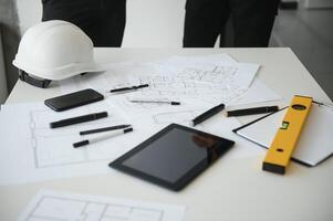 Team of architects people in group on construciton site check documents and business workflow photo