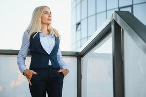 Portrait of business woman smiling outdoor photo