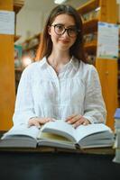 Beautiful girl in a library photo