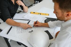 Engineers are helping to design work on blueprints and collaborate on structural analyzing of project types. photo