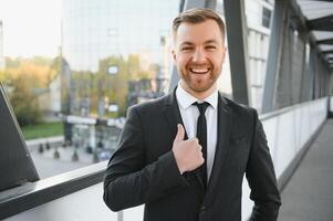 Portrait of a smiling businessman in a modern business environment photo