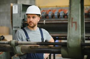 worker in factory on the machine photo