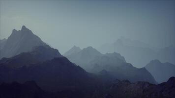 A misty mountain range in the fog video