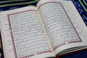 Quran, Al Qur'an, Islamic background for Eid al-Fitr Eid al-Adha. Open page of Al-Quran. Islamic concept photo