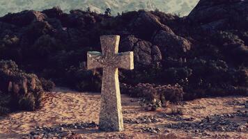 A solitary cross standing in the vastness of a desert landscape video