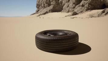 A tire sitting on top of a sandy beach video