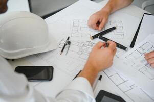 Team of architects people in group on construciton site check documents and business workflow photo