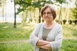 Smiling senior woman having recreation in park. photo