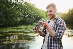 Trout fishing on mountain river photo