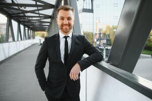 Portrait of a smiling businessman in a modern business environment photo