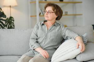 Closeup portrait of older woman wearing glasses. photo