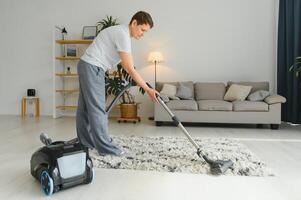 Middle-aged woman cleaning new apartment. photo