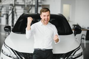 Man buying a car at a showroom photo