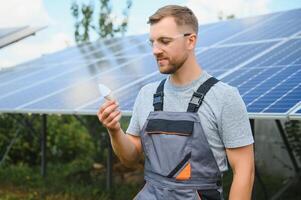 confident man and power solar station photo