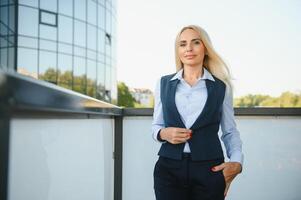 Portrait of business woman smiling outdoor photo