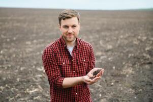 Soil in farmer arms. image with selective focus. photo