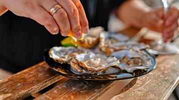 Mediterranean food. Elegant woman loving gastronomy feeling wonderful while enjoying eating Mediterranean food photo