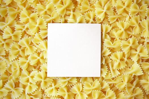 A lot of pasta in the shape of a butterfly on the table as a background, texture. photo