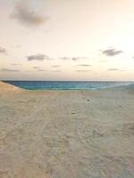 sunrise on beach, with sand view. photo